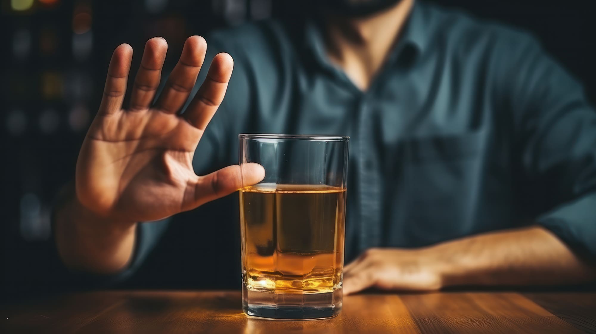 man smile and refuses say no and avoid to drink an alcohol whisk man smile and refuses say no and avoid to drink an alcohol whiskey , stopping hand sign male, alcoholism treatment, alcohol addiction, quit booze, Stop Drinking Alcohol. Refuse Glass liquor
